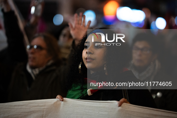 Protesters hold placards and wave Palestinian flags during a rally organized by political parties (La France Insoumise - LFI, Les Ecologiste...