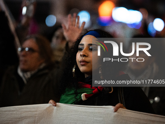 Protesters hold placards and wave Palestinian flags during a rally organized by political parties (La France Insoumise - LFI, Les Ecologiste...