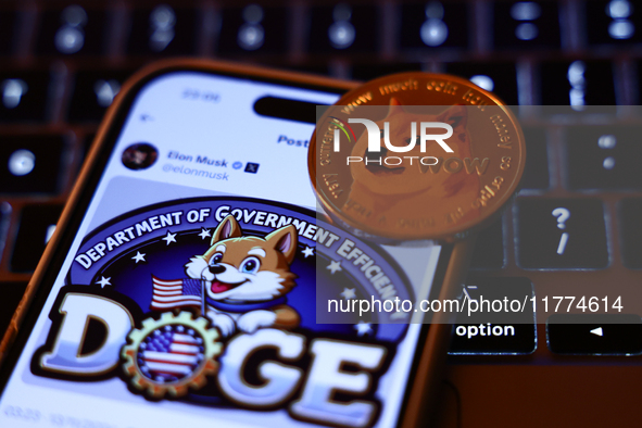 A laptop keyboard, Elon Musk post about DOGE on X displayed on a phone screen and representation of Dogecoin cryptocurrency  are seen in thi...