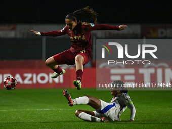 Alice Corelli of A.S. Roma Femminile and Wendie Renard of Olympique Lyonnais are in action during Group A - Day 3 of the UEFA Women's Champi...