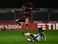 Alice Corelli of A.S. Roma Femminile and Wendie Renard of Olympique Lyonnais are in action during Group A - Day 3 of the UEFA Women's Champi...