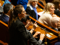 Aurore Berge, deputy of the Ensemble pour la Republique (EPR) government party, speaks during the public session of questions to the French...