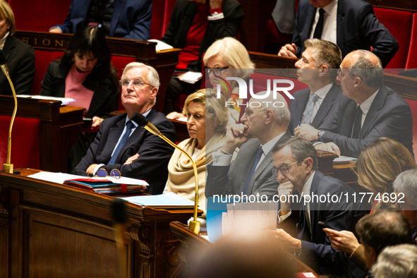 In Paris, France, on December 11, 2024, from left to right, Prime Minister Michel Barnier, Nathalie Delattre, Minister attached to the Prime...