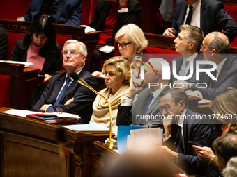 In Paris, France, on December 11, 2024, from left to right, Prime Minister Michel Barnier, Nathalie Delattre, Minister attached to the Prime...