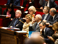 In Paris, France, on December 11, 2024, from left to right, Prime Minister Michel Barnier, Nathalie Delattre, Minister attached to the Prime...