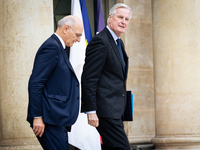 Didier Migaud, Keeper of the Seals and Minister of Justice, and Michel Barnier, French Prime Minister, are seen at the end of the council of...