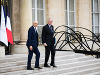 Didier Migaud, Keeper of the Seals and Minister of Justice, and Michel Barnier, French Prime Minister, are seen at the end of the council of...