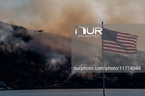 Army National Guard Blackhawk helicopters use water from Greenwood Lake to fight the Jennings Creek Wildfire in Greenwood Lake, NY, U.S., on...