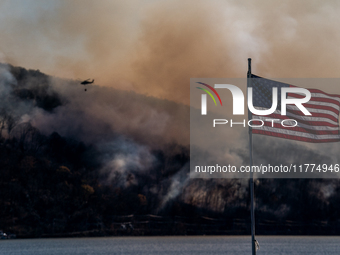 Army National Guard Blackhawk helicopters use water from Greenwood Lake to fight the Jennings Creek Wildfire in Greenwood Lake, NY, U.S., on...