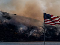 Army National Guard Blackhawk helicopters use water from Greenwood Lake to fight the Jennings Creek Wildfire in Greenwood Lake, NY, U.S., on...