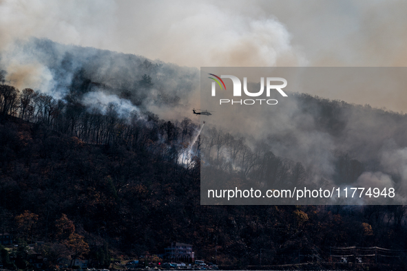 Army National Guard Blackhawk helicopters use water from Greenwood Lake to fight the Jennings Creek Wildfire in Greenwood Lake, NY, U.S., on...