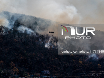 Army National Guard Blackhawk helicopters use water from Greenwood Lake to fight the Jennings Creek Wildfire in Greenwood Lake, NY, U.S., on...