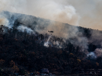 Army National Guard Blackhawk helicopters use water from Greenwood Lake to fight the Jennings Creek Wildfire in Greenwood Lake, NY, U.S., on...