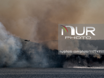 Army National Guard Blackhawk helicopters use water from Greenwood Lake to fight the Jennings Creek Wildfire in Greenwood Lake, NY, U.S., on...