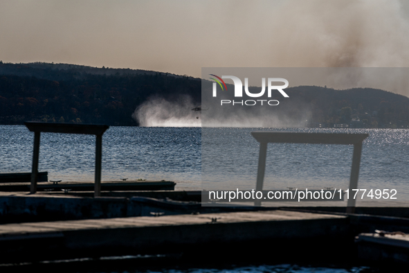 Army National Guard Blackhawk helicopters use water from Greenwood Lake to fight the Jennings Creek Wildfire in Greenwood Lake, NY, U.S., on...