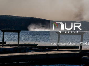 Army National Guard Blackhawk helicopters use water from Greenwood Lake to fight the Jennings Creek Wildfire in Greenwood Lake, NY, U.S., on...