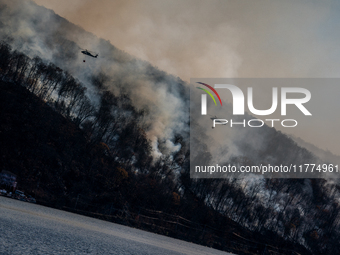 Army National Guard Blackhawk helicopters use water from Greenwood Lake to fight the Jennings Creek Wildfire in Greenwood Lake, NY, U.S., on...