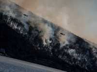 Army National Guard Blackhawk helicopters use water from Greenwood Lake to fight the Jennings Creek Wildfire in Greenwood Lake, NY, U.S., on...