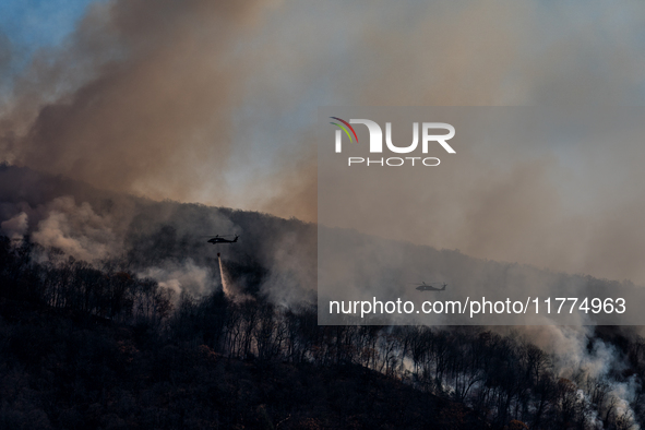 Army National Guard Blackhawk helicopters use water from Greenwood Lake to fight the Jennings Creek Wildfire in Greenwood Lake, NY, U.S., on...