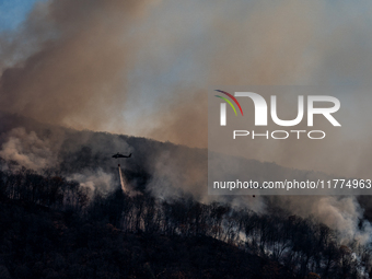 Army National Guard Blackhawk helicopters use water from Greenwood Lake to fight the Jennings Creek Wildfire in Greenwood Lake, NY, U.S., on...