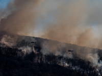 Army National Guard Blackhawk helicopters use water from Greenwood Lake to fight the Jennings Creek Wildfire in Greenwood Lake, NY, U.S., on...