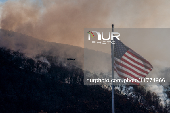 Army National Guard Blackhawk helicopters use water from Greenwood Lake to fight the Jennings Creek Wildfire in Greenwood Lake, NY, U.S., on...