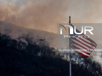 Army National Guard Blackhawk helicopters use water from Greenwood Lake to fight the Jennings Creek Wildfire in Greenwood Lake, NY, U.S., on...