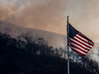 Army National Guard Blackhawk helicopters use water from Greenwood Lake to fight the Jennings Creek Wildfire in Greenwood Lake, NY, U.S., on...