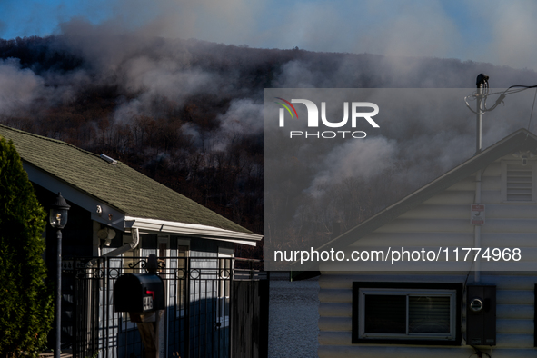 The Jennings Creek Wildfire burns near Greenwood Lake, NY, U.S., on November 13, 2024. The fire burns roughly 5000 acres with fire crews and...