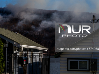 The Jennings Creek Wildfire burns near Greenwood Lake, NY, U.S., on November 13, 2024. The fire burns roughly 5000 acres with fire crews and...