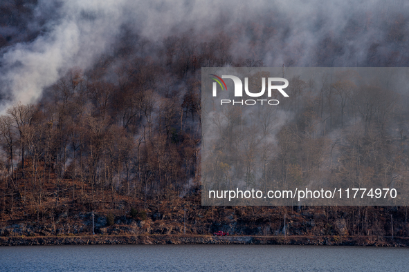 The Jennings Creek Wildfire burns near Greenwood Lake, NY, U.S., on November 13, 2024. The fire burns roughly 5000 acres with fire crews and...