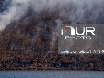 The Jennings Creek Wildfire burns near Greenwood Lake, NY, U.S., on November 13, 2024. The fire burns roughly 5000 acres with fire crews and...