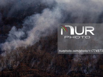 The Jennings Creek Wildfire burns near Greenwood Lake, NY, U.S., on November 13, 2024. The fire burns roughly 5000 acres with fire crews and...