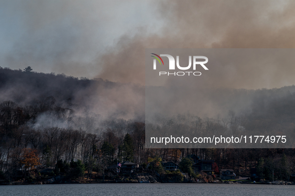 The Jennings Creek Wildfire burns near Greenwood Lake, NY, U.S., on November 13, 2024. The fire burns roughly 5000 acres with fire crews and...