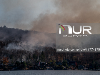 The Jennings Creek Wildfire burns near Greenwood Lake, NY, U.S., on November 13, 2024. The fire burns roughly 5000 acres with fire crews and...