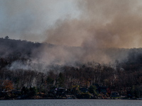 The Jennings Creek Wildfire burns near Greenwood Lake, NY, U.S., on November 13, 2024. The fire burns roughly 5000 acres with fire crews and...