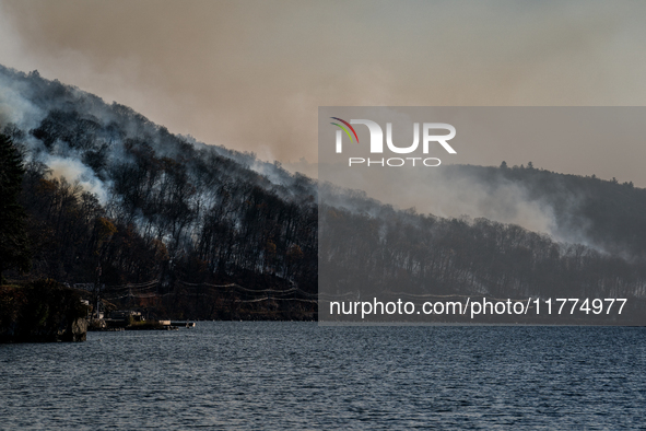 The Jennings Creek Wildfire burns near Greenwood Lake, NY, U.S., on November 13, 2024. The fire burns roughly 5000 acres with fire crews and...