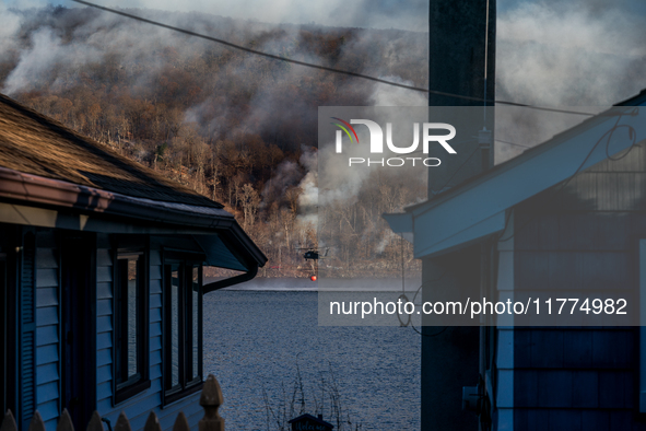 Army National Guard Blackhawk helicopters use water from Greenwood Lake to fight the Jennings Creek Wildfire in Greenwood Lake, NY, U.S., on...