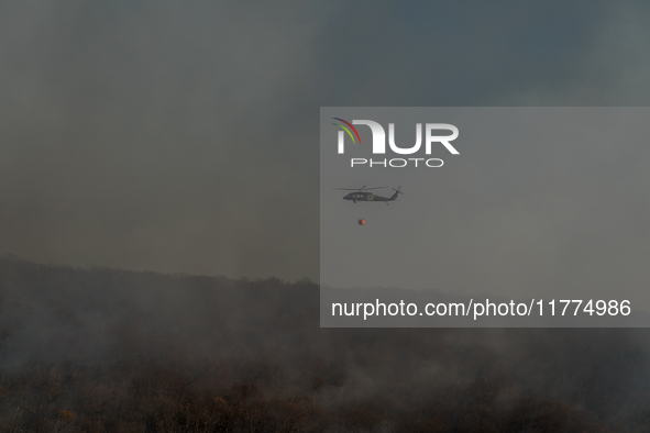 Army National Guard Blackhawk helicopters use water from Greenwood Lake to fight the Jennings Creek Wildfire in Greenwood Lake, NY, U.S., on...