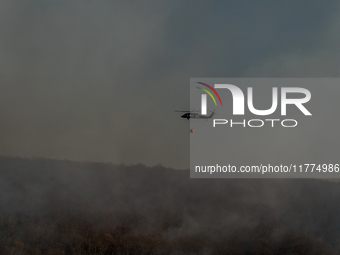 Army National Guard Blackhawk helicopters use water from Greenwood Lake to fight the Jennings Creek Wildfire in Greenwood Lake, NY, U.S., on...