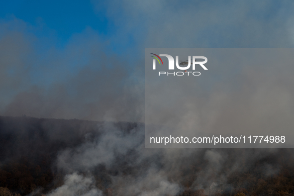 Army National Guard Blackhawk helicopters use water from Greenwood Lake to fight the Jennings Creek Wildfire in Greenwood Lake, NY, U.S., on...