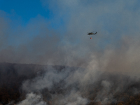 Army National Guard Blackhawk helicopters use water from Greenwood Lake to fight the Jennings Creek Wildfire in Greenwood Lake, NY, U.S., on...