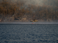 Army National Guard Blackhawk helicopters use water from Greenwood Lake to fight the Jennings Creek Wildfire in Greenwood Lake, NY, U.S., on...