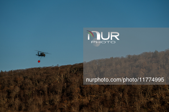 Army National Guard Blackhawk helicopters use water from Greenwood Lake to fight the Jennings Creek Wildfire in Greenwood Lake, NY, U.S., on...