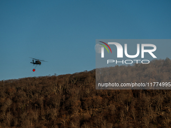 Army National Guard Blackhawk helicopters use water from Greenwood Lake to fight the Jennings Creek Wildfire in Greenwood Lake, NY, U.S., on...