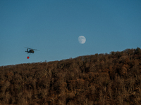 Army National Guard Blackhawk helicopters use water from Greenwood Lake to fight the Jennings Creek Wildfire in Greenwood Lake, NY, U.S., on...