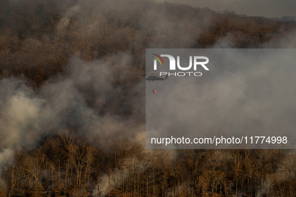 Army National Guard Blackhawk helicopters use water from Greenwood Lake to fight the Jennings Creek Wildfire in Greenwood Lake, NY, U.S., on...