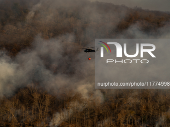 Army National Guard Blackhawk helicopters use water from Greenwood Lake to fight the Jennings Creek Wildfire in Greenwood Lake, NY, U.S., on...