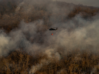 Army National Guard Blackhawk helicopters use water from Greenwood Lake to fight the Jennings Creek Wildfire in Greenwood Lake, NY, U.S., on...