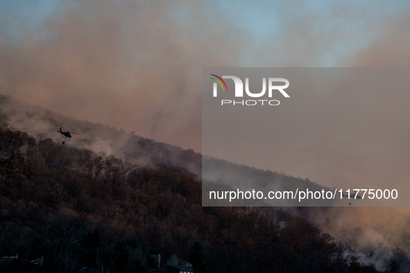 Army National Guard Blackhawk helicopters use water from Greenwood Lake to fight the Jennings Creek Wildfire in Greenwood Lake, NY, U.S., on...